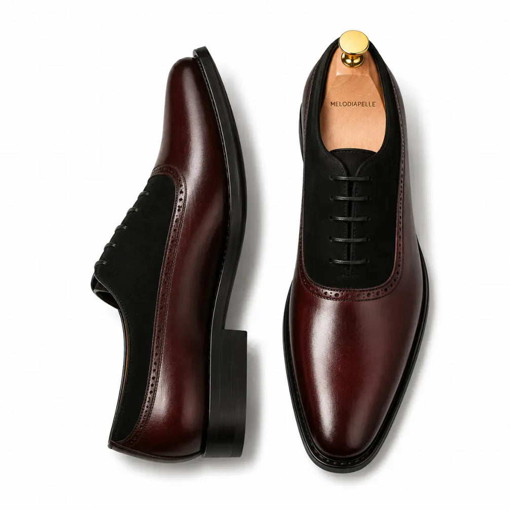Burgundy leather and black suede Oxford, three-quarter angle showing heel and two-tone detailing