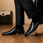 Melodiapelle Farida Mule in black leather worn with formal trousers, on-feet shot