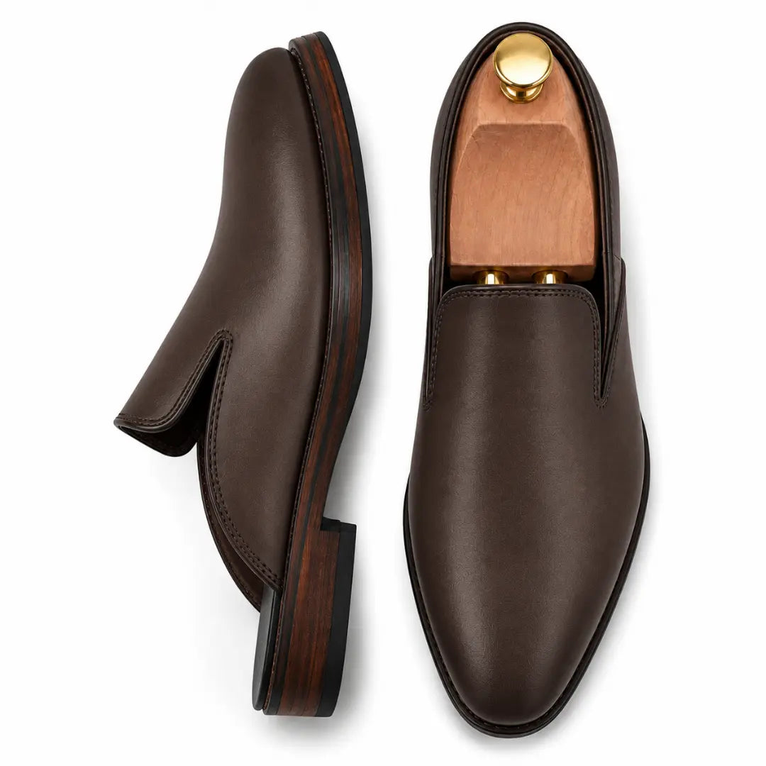 Dark brown leather backless mule, three-quarter angle showing sole detailing