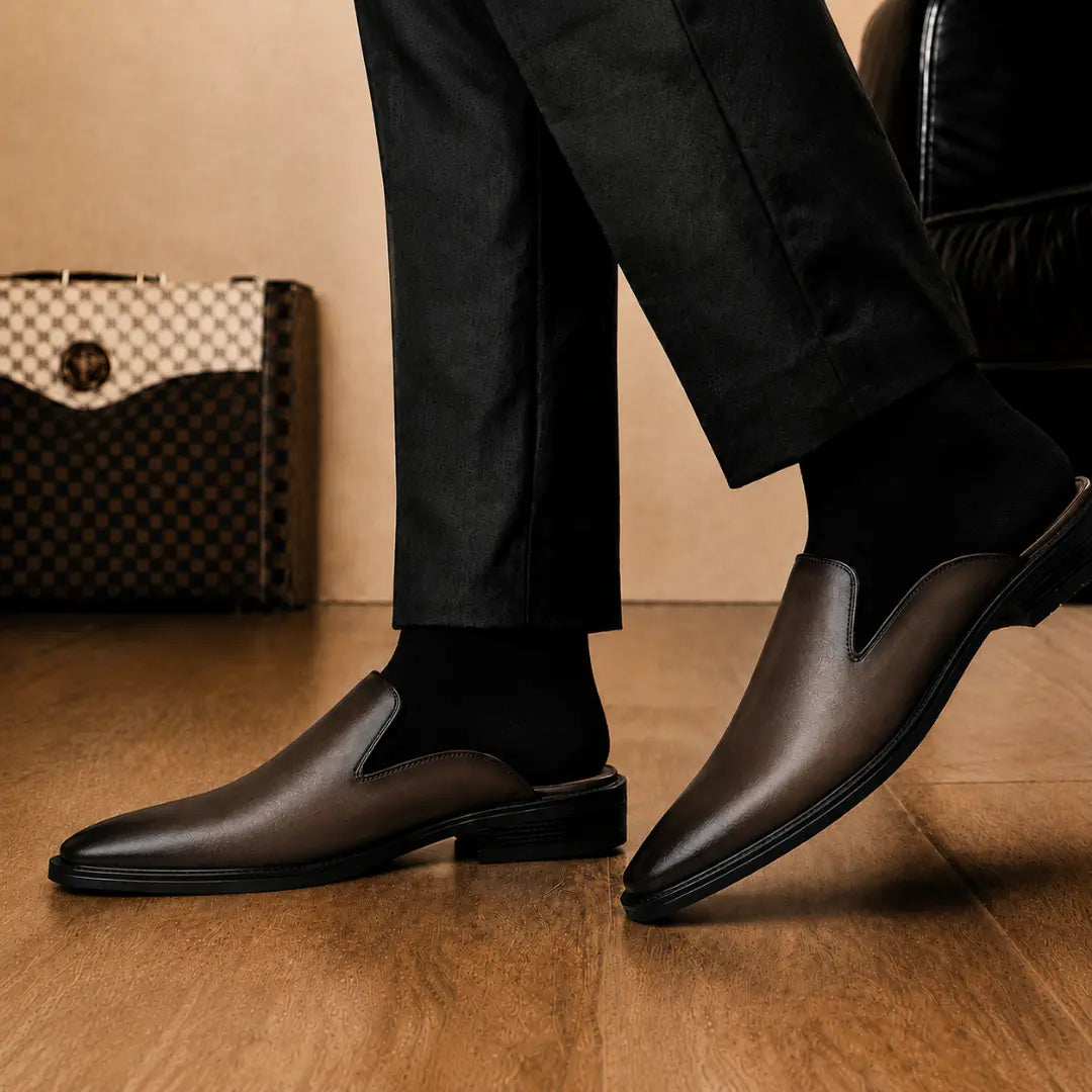 Melodiapelle Farida Mule in dark brown leather worn with formal trousers, on-feet shot