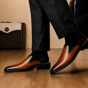 Melodiapelle Farida Mule in rust tan leather worn with formal trousers, on-feet shot