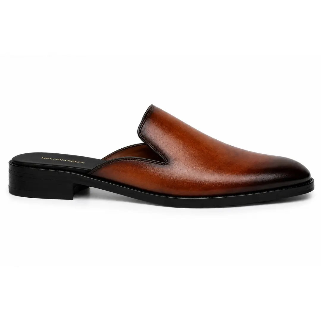 Side profile of the Farida Mule in rust tan leather on white background