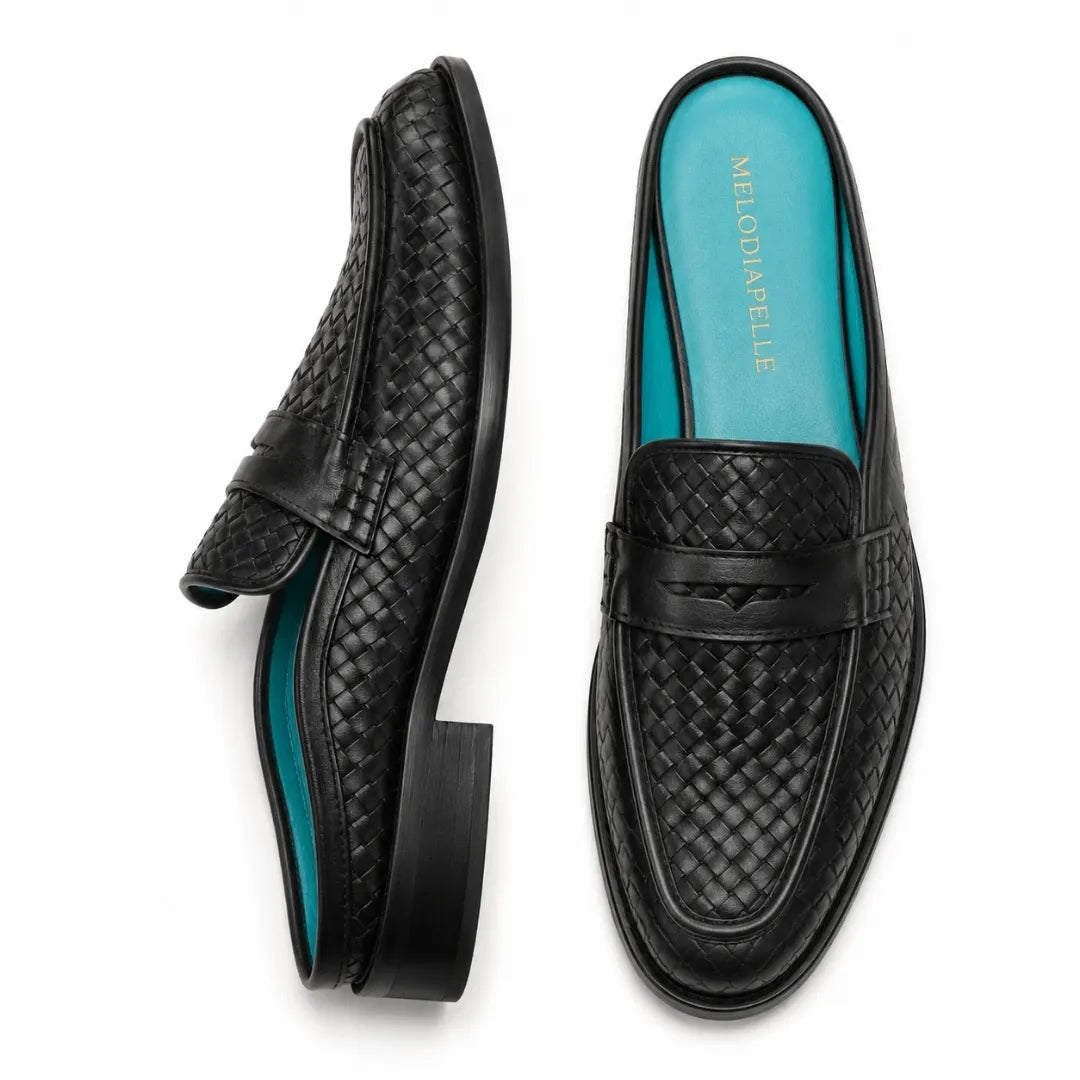 Black woven leather penny mule, three-quarter angle showing heel and woven texture