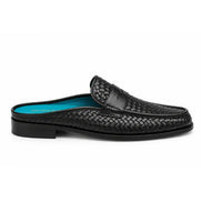 Side profile of the Madana Mule in black woven leather on white background