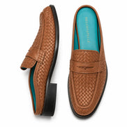 Tan woven leather penny mule, three-quarter angle showing heel and woven texture