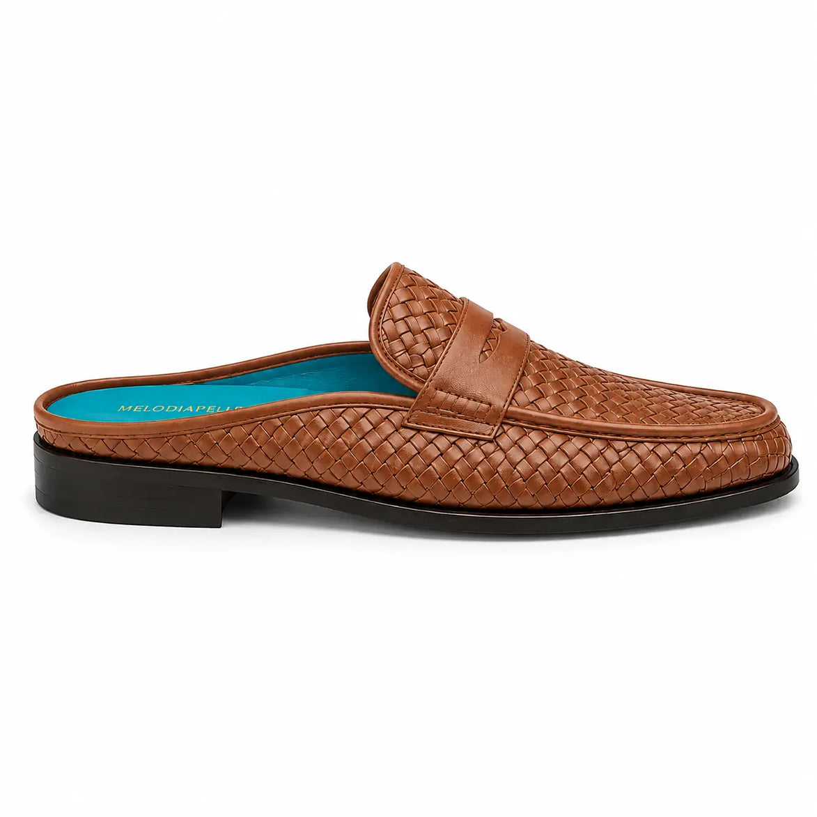 Side profile of the Madana Mule in tan woven leather on white background