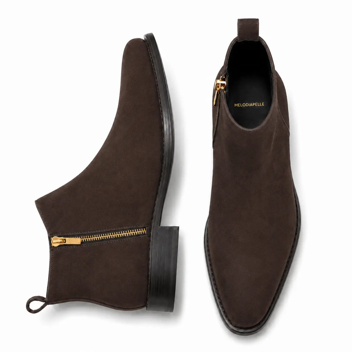 Brown suede zip boot, three-quarter angle showing side zip, heel and sole detailing