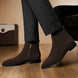Melodiapelle Maddox Suede Zip Boot in brown suede worn with trousers, on-feet shot