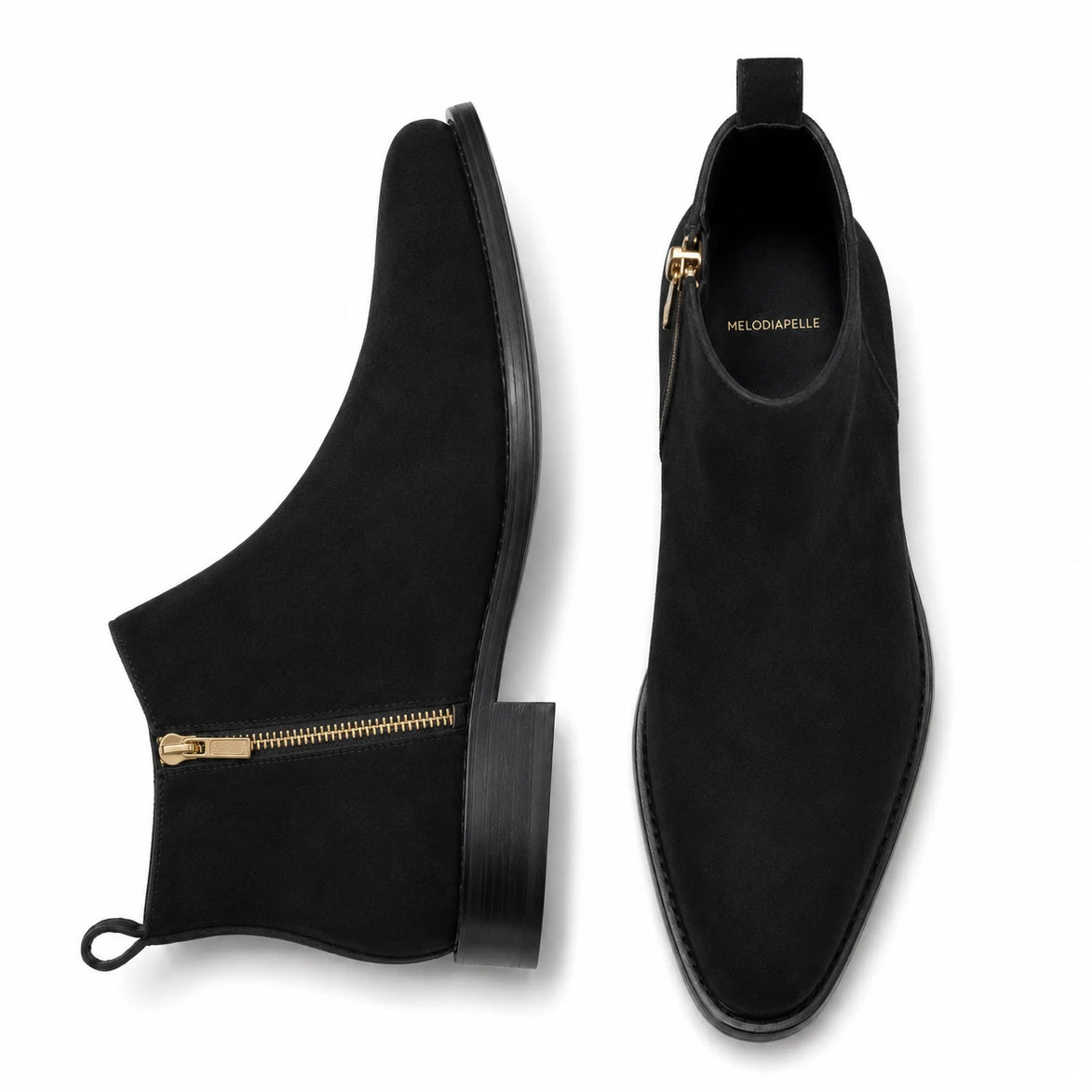 Black suede zip ankle boots, three-quarter angle showing side zipper and heel