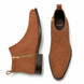 Tan suede zip boot, three-quarter angle showing side zip, heel and sole detailing