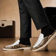 Melodiapelle Madise Mule in white and snake-print brown leather worn with trousers, on-feet shot