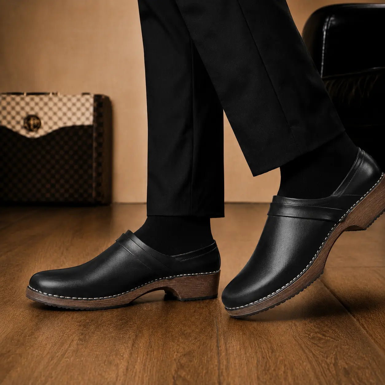 Melodiapelle Madison Mule in black leather worn with formal trousers, on-feet shot