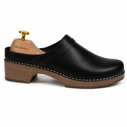 Side profile of the Madison Mule in black leather on white background