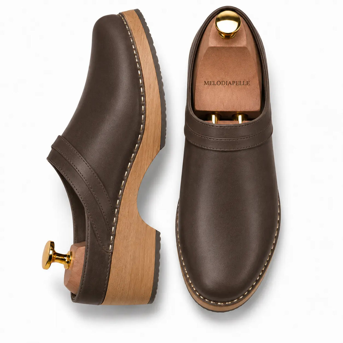 Dark brown leather backless mule, three-quarter angle showing heel and sole detailing