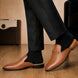 Melodiapelle Madison Mule in tan leather worn with formal trousers, on-feet shot