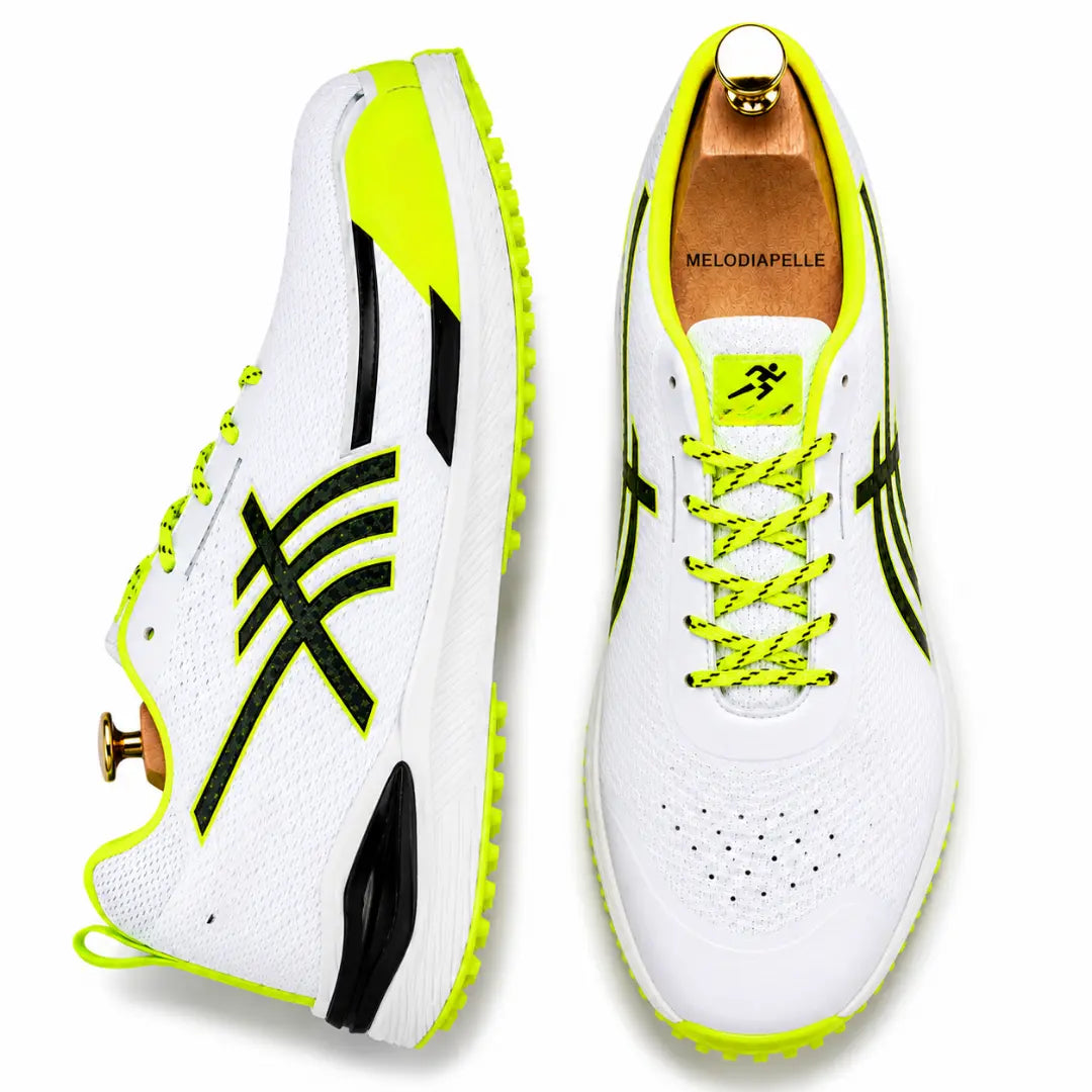 White and neon yellow cricket shoe, three-quarter angle showing heel and sole detailing