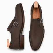 Dark chocolate leather single monk strap shoe, three-quarter angle showing buckle and heel