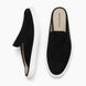 Black suede mule with white sneaker-sole, three-quarter angle showing heel and sole detailing