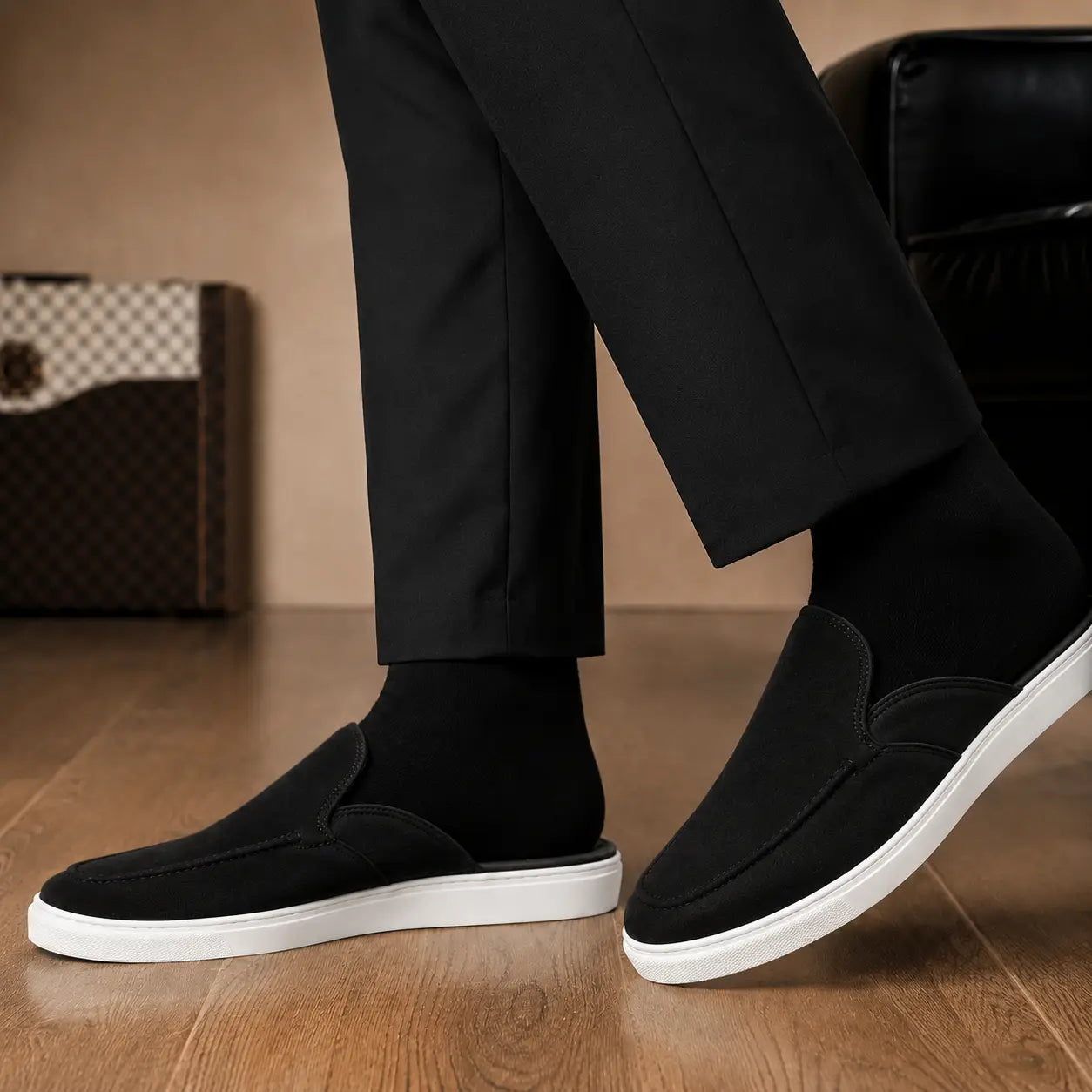 Melodiapelle Madurai Mule in black suede worn with trousers, on-feet shot