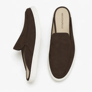 Dark brown suede mule with white sneaker-sole, three-quarter angle showing heel and sole detailing