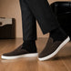 Melodiapelle Madurai Mule in dark brown suede worn with trousers, on-feet shot