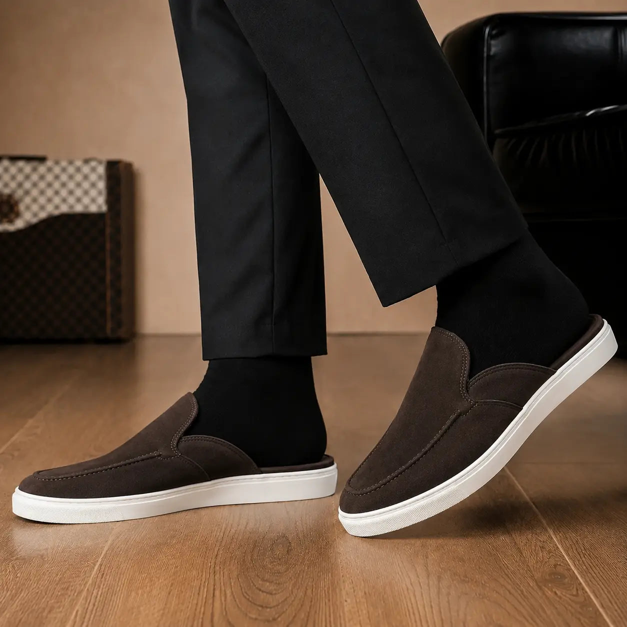 Melodiapelle Madurai Mule in dark brown suede worn with trousers, on-feet shot