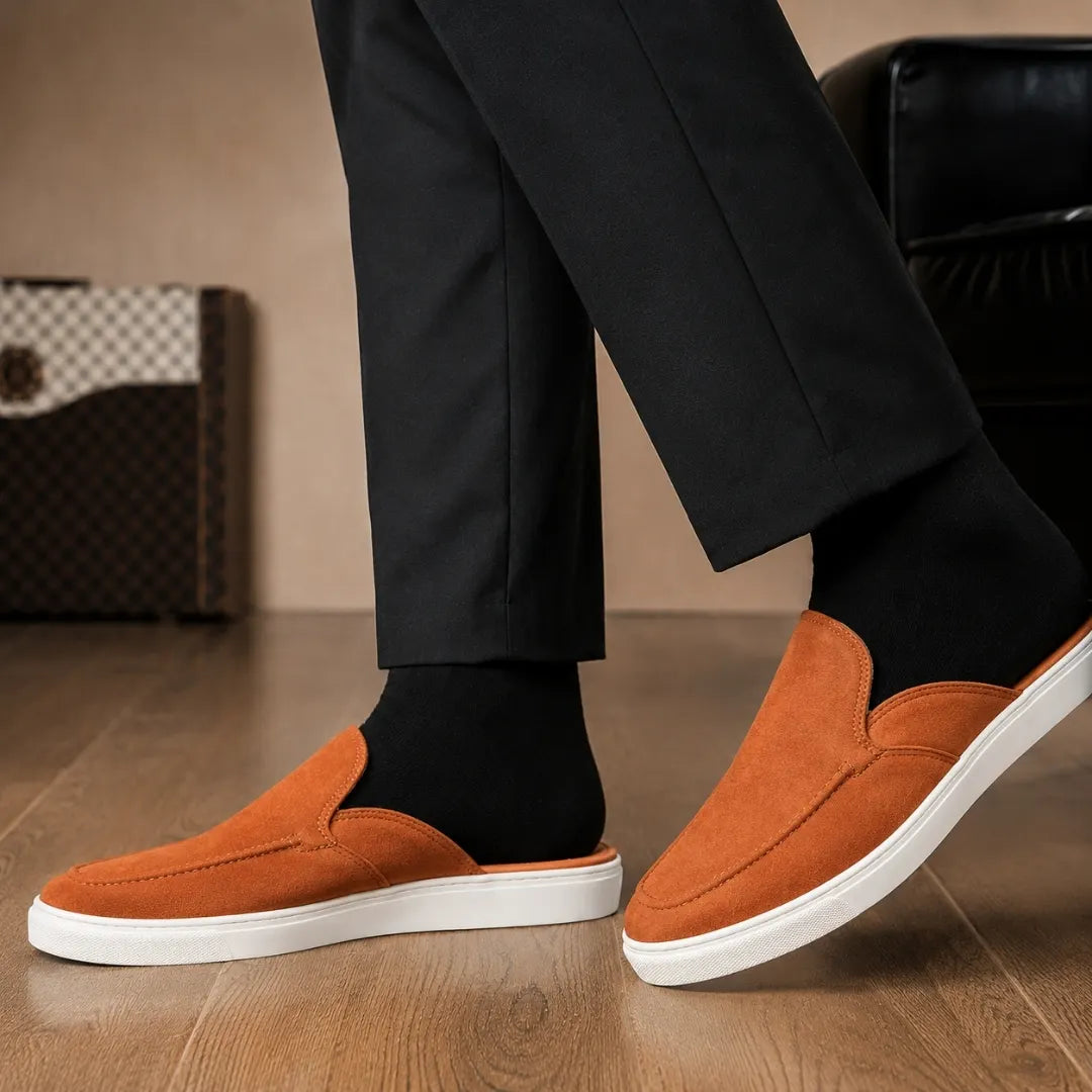 Melodiapelle Madurai Mule in rust tan suede worn with trousers, on-feet shot