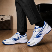 Melodiapelle Maduro Cricket Shoe in white and royal blue worn with trousers, on-feet shot