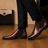 Melodiapelle Magna Chelsea Boot in dark brown leather worn with trousers, on-feet shot