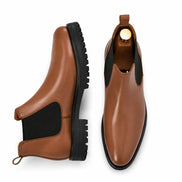Tan leather Chelsea boot, three-quarter angle showing heel and sole detailing
