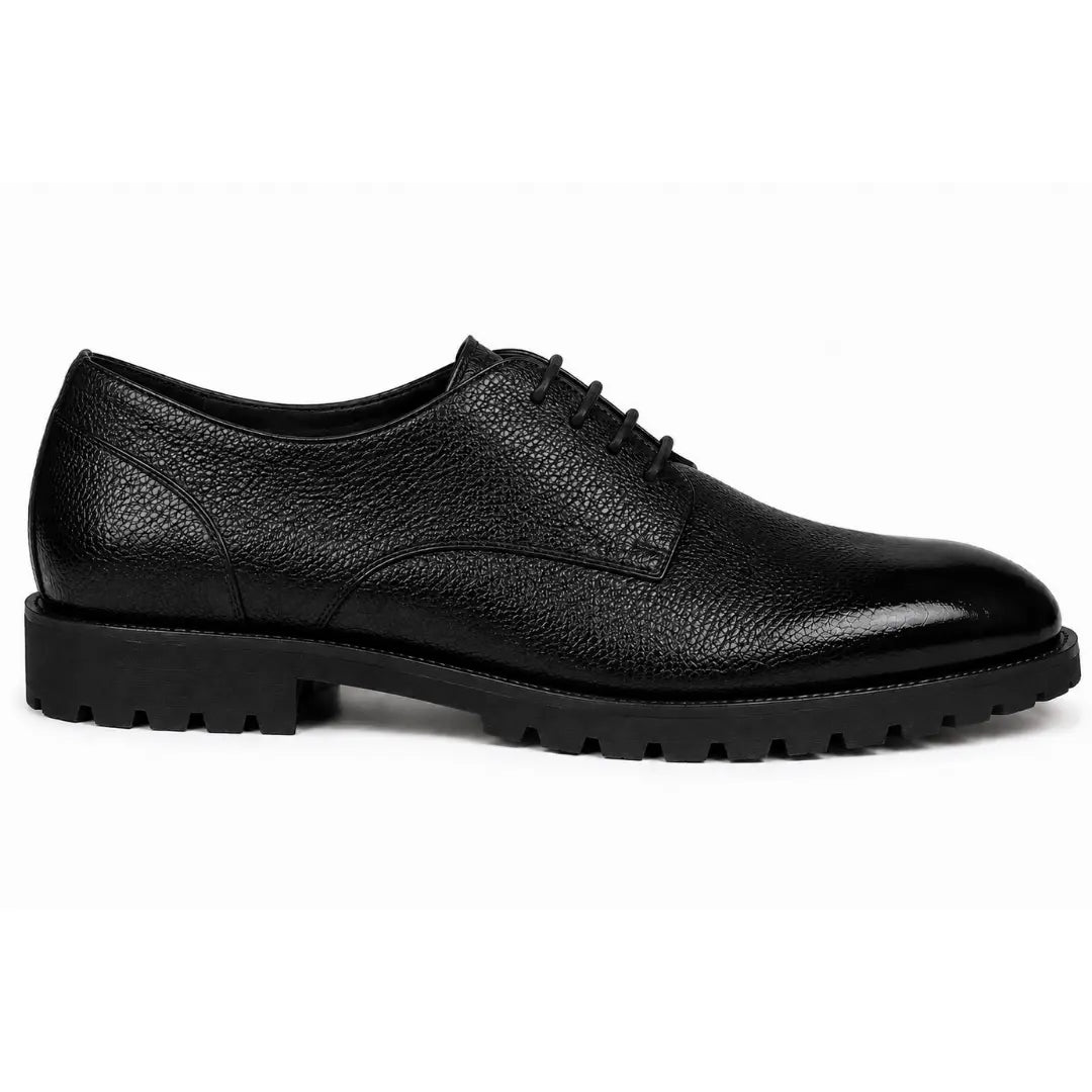 Side profile of the Magnum Derby Shoe in black leather on white background