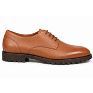 Side profile of the Magnum Derby Shoe in tan leather on white background