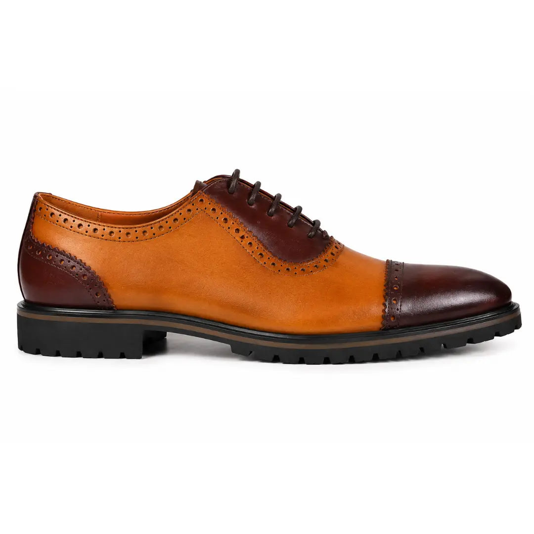 Side profile of the Maiden Oxford Shoes in tan and dark brown leather on white background