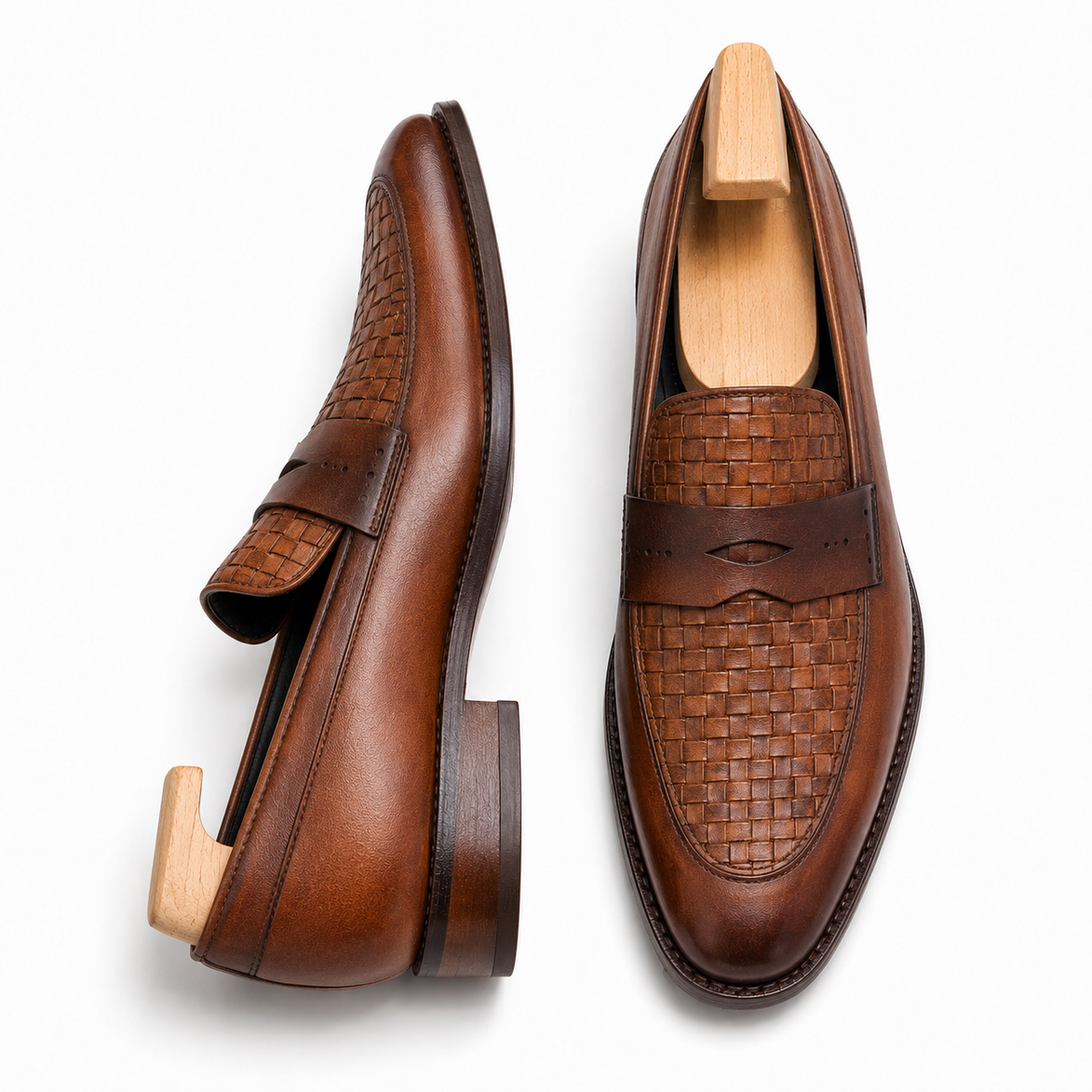 Cognac tan leather woven penny loafer, three-quarter angle showing heel and woven detailing