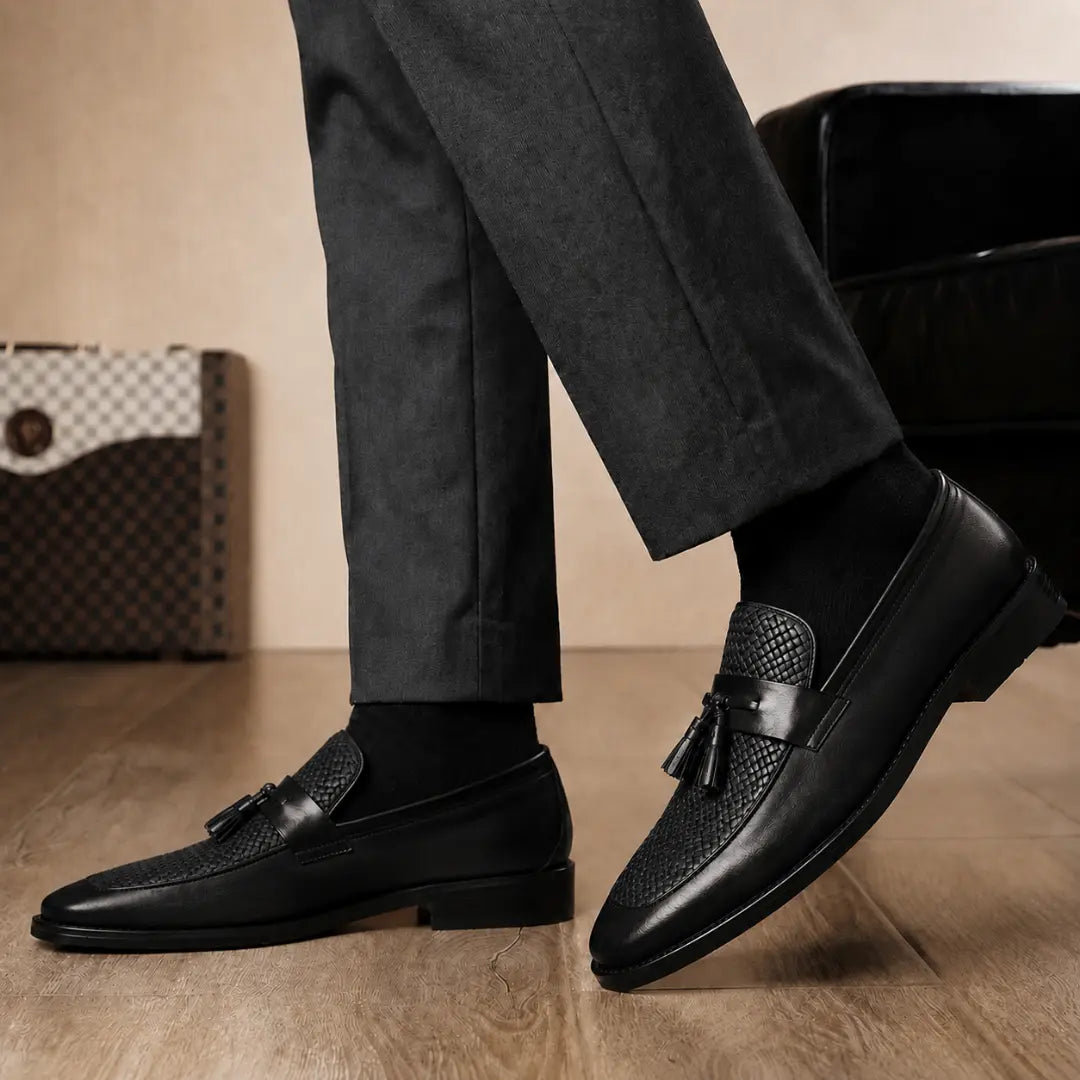 Melodiapelle Maison Woven Two-Tone Penny Loafer in black leather worn with formal trousers, on-feet shot