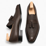 Brown woven leather penny loafer, three-quarter angle showing tassel and heel detailing