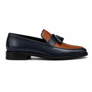 Side profile of the Maison Woven Two-Tone Penny Loafer in midnight navy and tan leather on white background