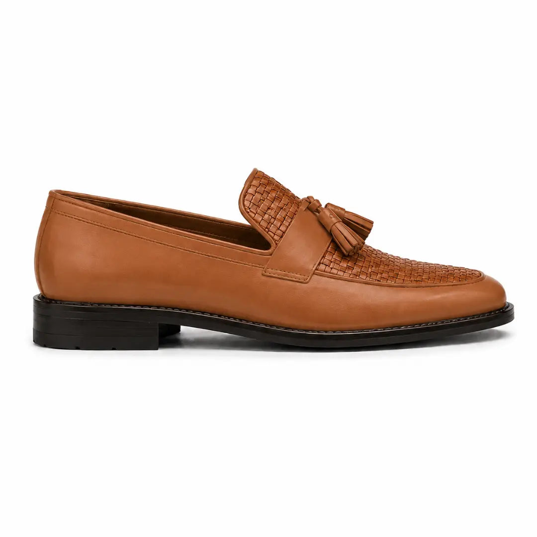 Side profile of the Maison Woven Two-Tone Penny Loafer in tan leather on white background