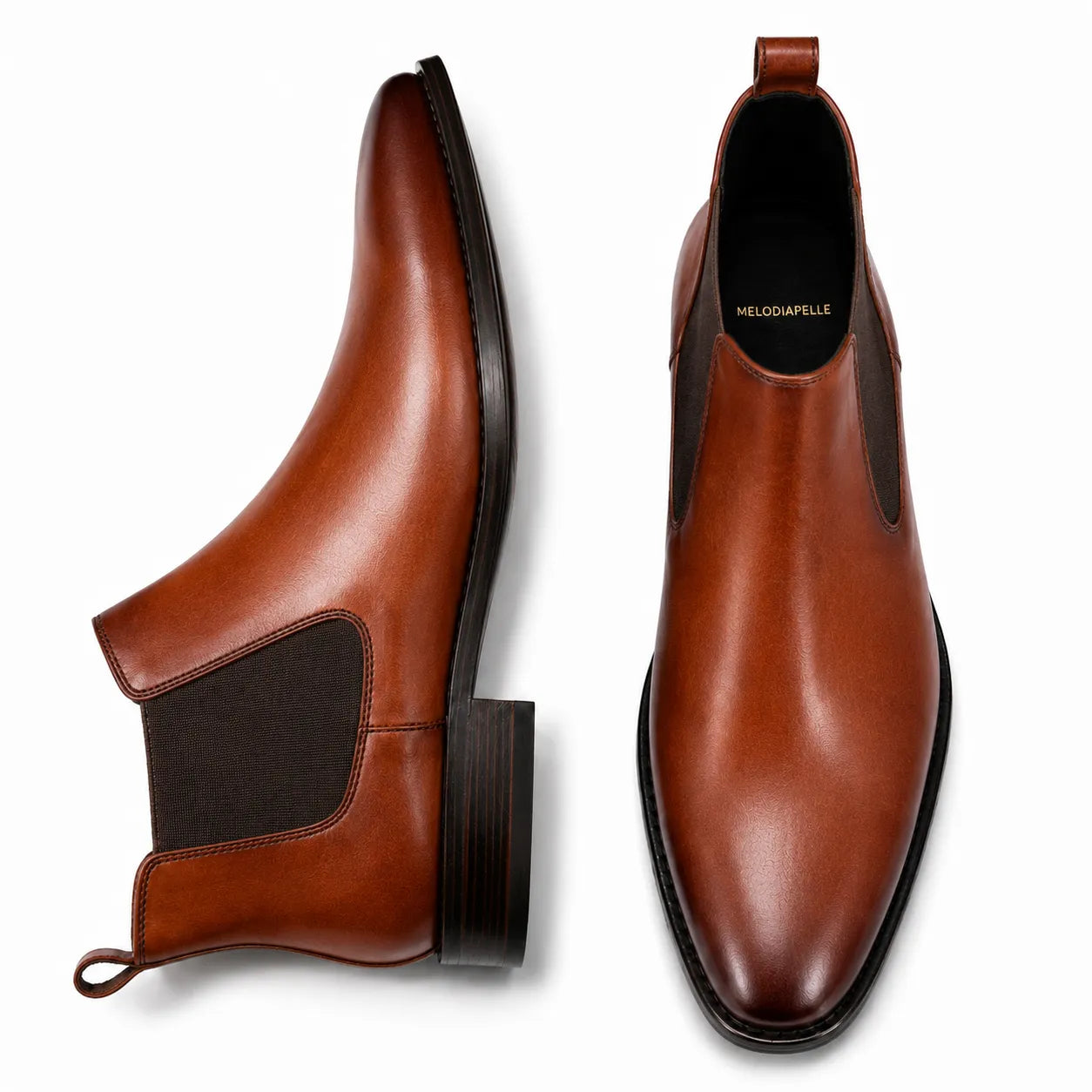 Cognac tan leather Chelsea boots, three-quarter angle showing elastic side panel and heel