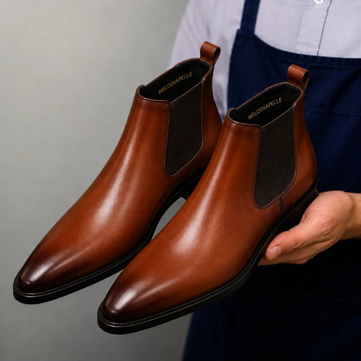 Man wearing Melodiapelle Malacca Chelsea Boot in cognac tan with formal trousers, on-feet shot