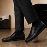 Melodiapelle Malaga Driving Loafer in black leather worn with trousers, on-feet shot