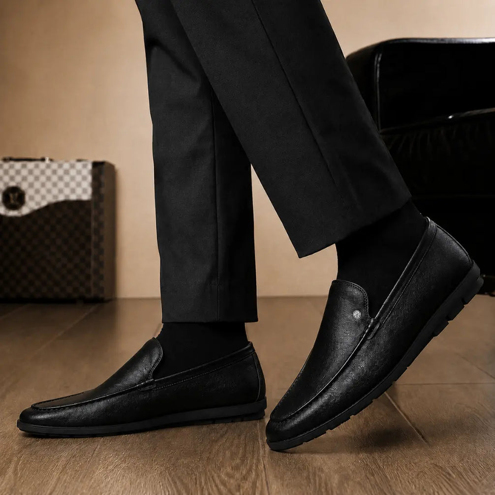 Melodiapelle Malaga Driving Loafer in black leather worn with trousers, on-feet shot