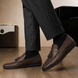 Man wearing Melodiapelle Malaga Driving Loafer in dark chocolate leather with trousers, on-feet shot