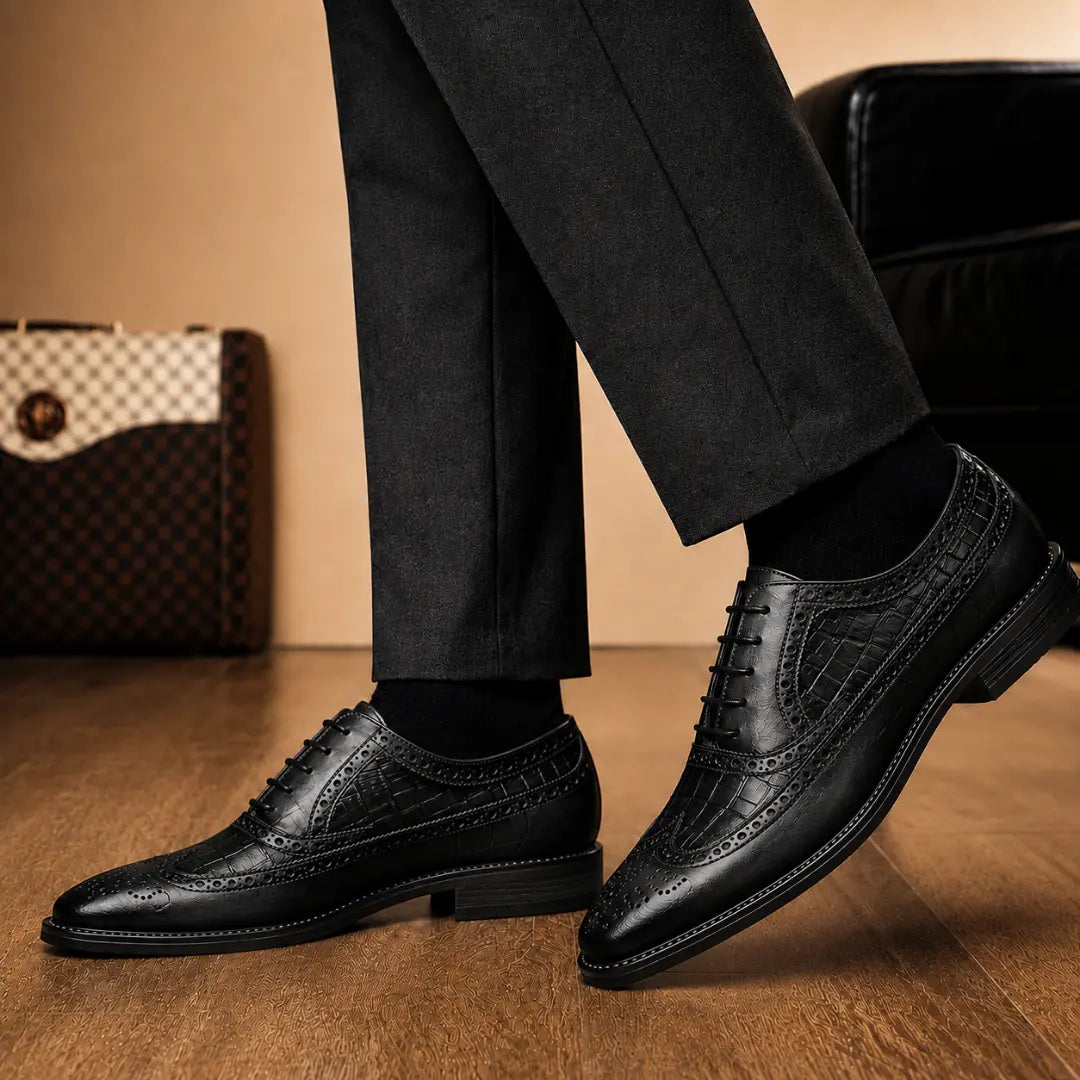 Melodiapelle Malcomb Croc-Panel Wingtip Derby in black leather worn with formal trousers, on-feet shot
