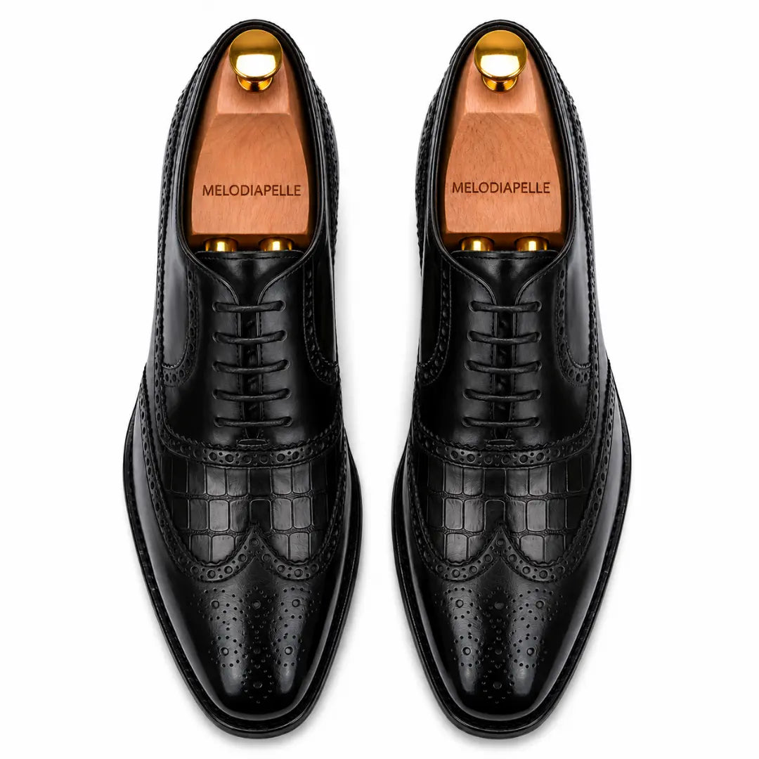 Melodiapelle Malcomb Croc-Panel Wingtip Derby in black leather, pair top-down view, handcrafted in Agra