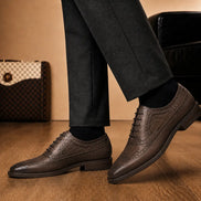 Melodiapelle Malcomb Croc-Panel Wingtip Derby in brown leather worn with formal trousers, on-feet shot