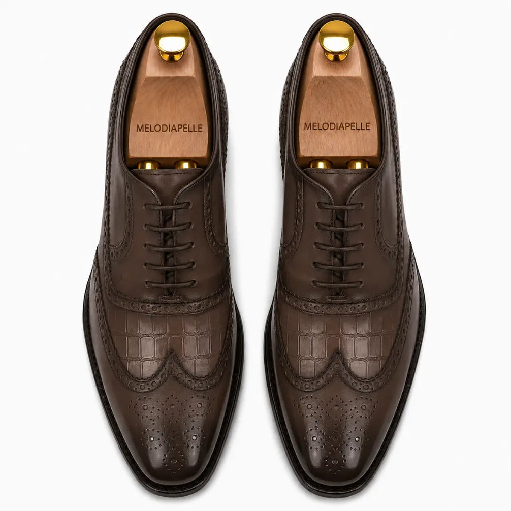 Melodiapelle Malcomb Croc-Panel Wingtip Derby in brown leather, pair top-down view, handcrafted in Agra
