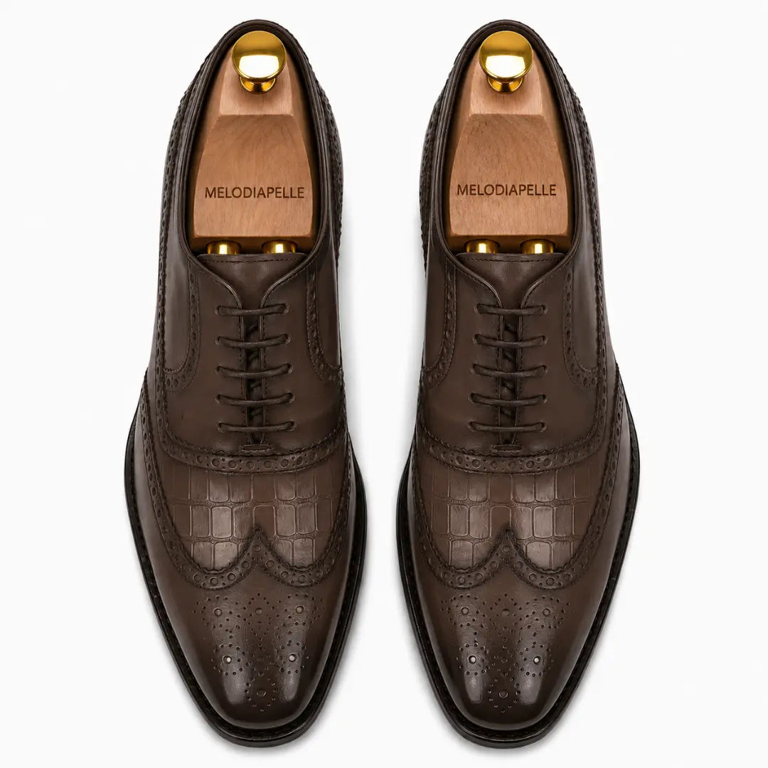 Melodiapelle Malcomb Croc-Panel Wingtip Derby in brown leather, pair top-down view, handcrafted in Agra