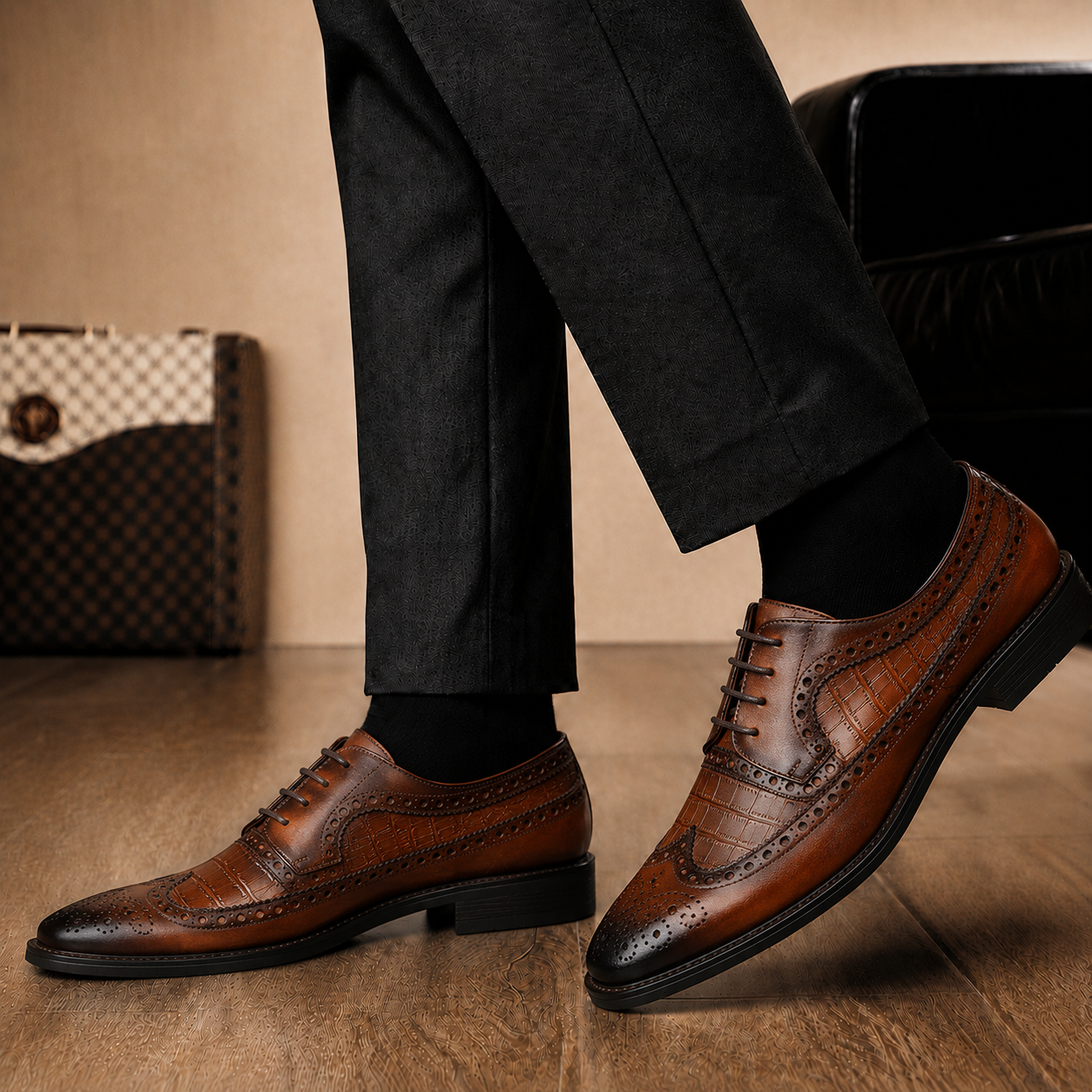 Melodiapelle Malcomb Croc-Panel Wingtip Derby in cognac and dark brown leather worn with formal trousers, on-feet shot