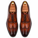 Melodiapelle Malcomb Croc-Panel Wingtip Derby in cognac and dark brown leather, pair top-down view, handcrafted in Agra